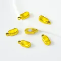 Vista dettagliata delle chiusure magnetiche a capsula dorata per creare gioielli - Stile Lingotto / Oro