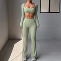 Sage green two-piece yoga set with long sleeve crop top and flared fitness leggings - Green / XS