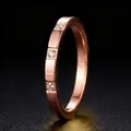Minimalist rose gold titanium steel band ring featuring three sparkling small zircon stones - US 5 / Rose Gold with Zirconias