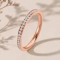 Elegant rose gold stainless steel ring featuring a half-eternity band of sparkling crystals - US 5 / Half Row Pave Style (36-B-3) / Rose Gold
