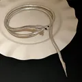 Elegante flexibele zilveren slangenketting met vintage design en glinsterende metalen schubben - Halsring - Zilver