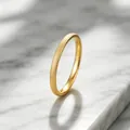 Detailed macro view of gold frosted titanium steel ring featuring a textured sparkling finish - Size 5 / 2mm / Gold