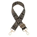 Detail view of woven geometric patterned handbag strap with gold-tone metal clips - Black Khaki