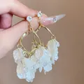Exaggerated golden drop earrings with layered white petal tassels and zircon studs - Spiral Shell Rhinestone Cup Studs Gold