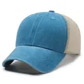 Side view of a washed blue trucker hat with a beige mesh back and plain design - Adjustable / Lake Blue