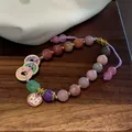 Handcrafted beaded bracelet with Chinese coin and cat charms on adjustable purple cord - Painted Copper Coins