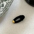 Elegant black velvet oval hair clip featuring a minimalist gold irregular bean accent for women - Gold Bead Decor Hair Clip / Black