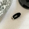 Elegant black velvet oval hair clip featuring a delicate sparkling rhinestone bow - Velvet Oval Rhinestone Bow Clip (J300-B230) / Black
