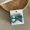 Set of two elegant teal grosgrain ribbon bow hair clips on a white display card. - Ribbon Bow Hair Clip Pair (52-B87) / 2 Pcs/Set / Teal