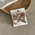 Pair of elegant beige grosgrain ribbon bow hair clips on white display card for women - Bow Hair Clip Pair (52-B87) / 2 Pcs/Set / Khaki