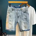 Fashionable men's light blue denim shorts featuring distressed rips and paint splatters - EU 38 / Light Blue Paint Splatter Ripped Style (TC049#)