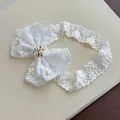 Elegant white floral lace baby headband featuring a large bow decorated with pearl and rhinestone - White Lace Headband with Rhinestones
