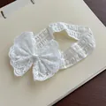 Elegant white lace baby headband with a large bow detail for infant girls hair styling - White Cotton Headband with Bow