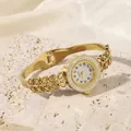 Elegant gold stainless steel bracelet watch with hollow leaf design and rhinestone bezel - Leaf Style
