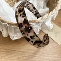 Macro view of leopard print acrylic headband with vibrant multi-colored rhinestones - White Leopard (Colorful Rhinestone)