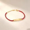 Detailed view of gold stainless steel bracelet with red stones and engraving plate. - Round Red Rhinestone Style (A635-爪锆-手链) / Gold