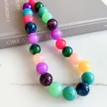 Close-up of vibrant dopamine style acrylic beaded necklace on marble background - Marble Round Bead Necklace / Colorful