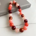 Close-up of vibrant multi-colored acrylic beaded necklace with glossy marble texture - Multicolor Dopamine Large Diameter Beaded Necklace (83#) / Necklace #83 - Red, Orange, Pink