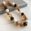 Close-up of colorful acrylic beaded necklace with glossy finish and large beads - Coffee and White Large Acrylic Round Bead Necklace (84#) / Necklace #84 - White, Brown