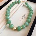Close-up detail of a summer green beaded necklace with gold spacers in a jewelry box - Gold-Green (78#)