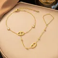 Elegantes vergoldetes Edelstahl-Handback-Kettenarmband mit Schweinenasen-Link-Design - Ovales Kettenglied Handkette (Gold)