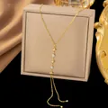 Elegant 18k gold plated stainless steel lariat necklace with North Star and zircon. - Starburst Tassel Necklaces with Double Rhinestones in Gold Color
