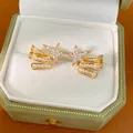 Elegant gold plated star ear clips with sparkling zircons in a green velvet box - Star Style / One Pair / Gold