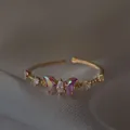 Elegante anello regolabile placcato oro 18K con design a farfalla in zircone iridescente - Oro / Stile Farfalla Viola Iridescente (Stile 45)