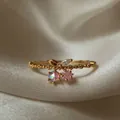 Anello regolabile placcato oro 18K con stella rosa e zircone iridescente design floreale - Oro / Stile Stella Perlata (Stile 46)