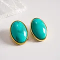 Vintage oval stud earrings featuring teal marble acrylic with elegant gold-tone metal frame - Cyan