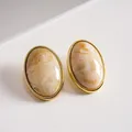 Vintage marbled acrylic oval stud earrings with elegant gold-toned metal frame - Khaki