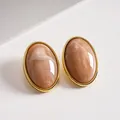 Vintage oval marbled acrylic stud earrings with elegant gold-tone metal frame. - Light Pink