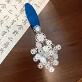 Detailed close-up view of a vintage blue fabric flower tassel hair clip for Hanfu. - Snap Hair Clip