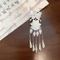 Detailed macro of a vintage silver butterfly and flower tassel hair clip for Hanfu. - Duckbill Clip (Style 2)