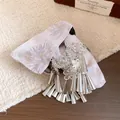 Macro detail of elegant ethnic hair claw clip featuring purple fabric bow and silver tassels - 2# Bow Embroidered Hair Claw / Pink