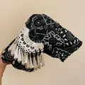 Detail view of ethnic style black printed bow hair claw clip with silver fringe tassels. - 4# Printed Decorative Hair Claw / Black