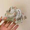 Detailed view of the ethnic style floral fabric hair claw clip with silver tassels. - Ethnic Style Embroidery Tassel Hair Claw / Silver-Green