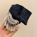 Detail of ethnic style hair clip with navy jacquard bow and silver tassel ornaments. - Ethnic Style Embroidery Tassel Hair Claw / Silver Gold Blue