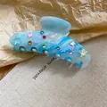Molletta per capelli in acrilico blu marmorizzato con strass colorati a stella. - 37# Pinza Sfumata Marmo Celeste / Blu