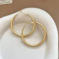 Close-up of matte gold retro hoop earrings on a white decorative ceramic dish. - Minimalist Hoop Style (78#) / 5cm / Matte Gold