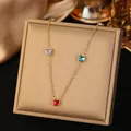 Close-up of gold titanium steel necklace with colorful butterfly zircons on display - Butterfly Necklaces with Colorful Rhinestones in Gold Color