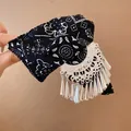 Close-up of vintage black paisley fabric hair claw clip with silver tassel charms. - Tassel Printed Hair Claw / Silver Black