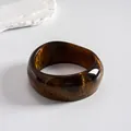 Close-up detail of retro brown resin bangle featuring gold foil marbling and glossy finish - Style 11 (Gold Foil Square Coffee)