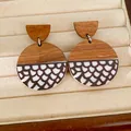 Detail view of ethnic retro round wood and resin earrings with scale pattern print - Fish Scale