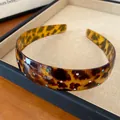 Close-up of French vintage leopard print acrylic headband with colorful rhinestones. - Coffee Leopard - Multicolor Rhinestone