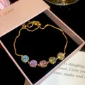 Detail of 18k gold plated bracelet with five colorful square cubic zirconia stones - Style 8