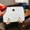 Elegant butterfly stud earrings featuring white enamel petals and a gold-tone finish - No. 9 Silver Post Earrings - Gold (Butterfly)