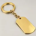 Macro detail view of a golden mirror polished stainless steel blank military dog tag keychain - Gold