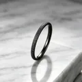 Macro view of a minimalist black frosted titanium steel ring with starry sky texture - Size 5 / 2mm / Black