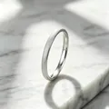 Close-up of elegant silver titanium steel ring with frosted starry texture on marble - Size 5 / 2mm / Silver